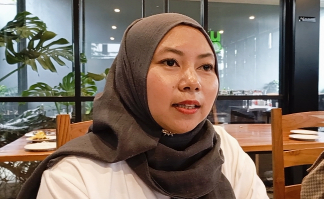 Evi Widiyawati pelaku UMKM menyampaikan testimoni usai mengikuti Workshop HKI Diskumperindag Kota Batu